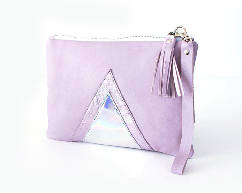 The front of a lavender leather wristlet with a triangular hologram panel from Gmalou Designs.