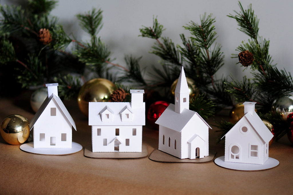 A four piece village ornament kit from Holiday Spirits Decor.