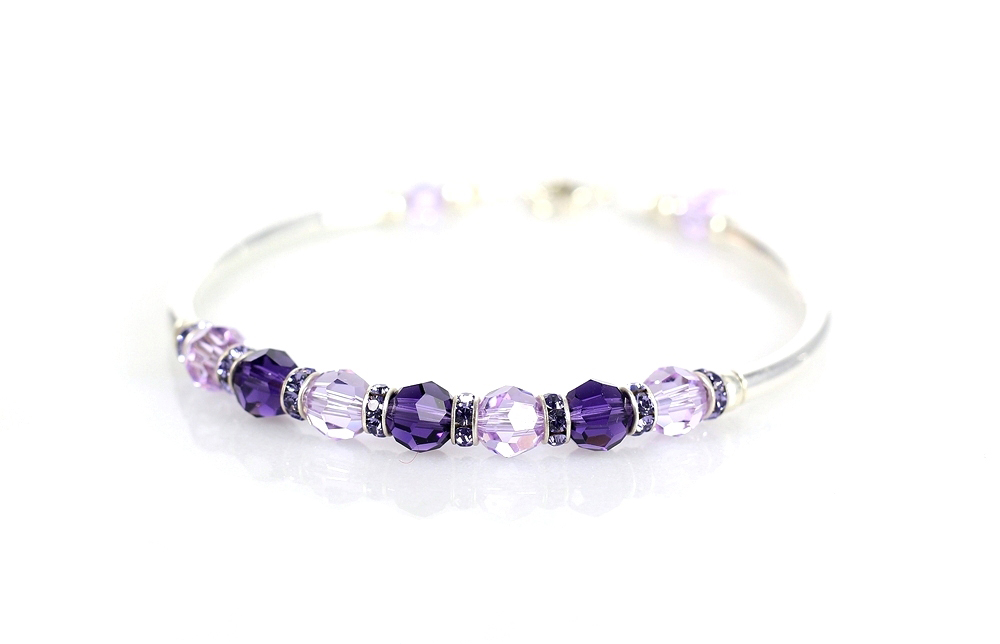 Light / dark purple crystal and sterling silver fitted bracelet.