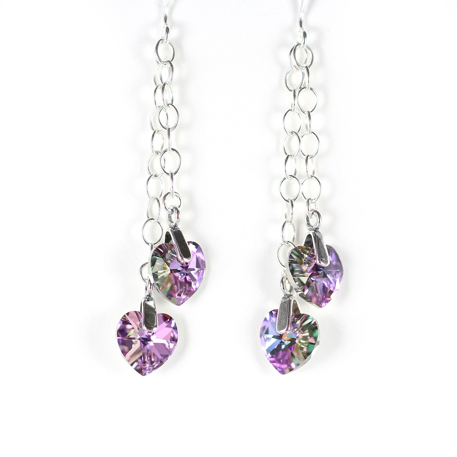 Light purple crystal heart earrings on long sterling silver chains.